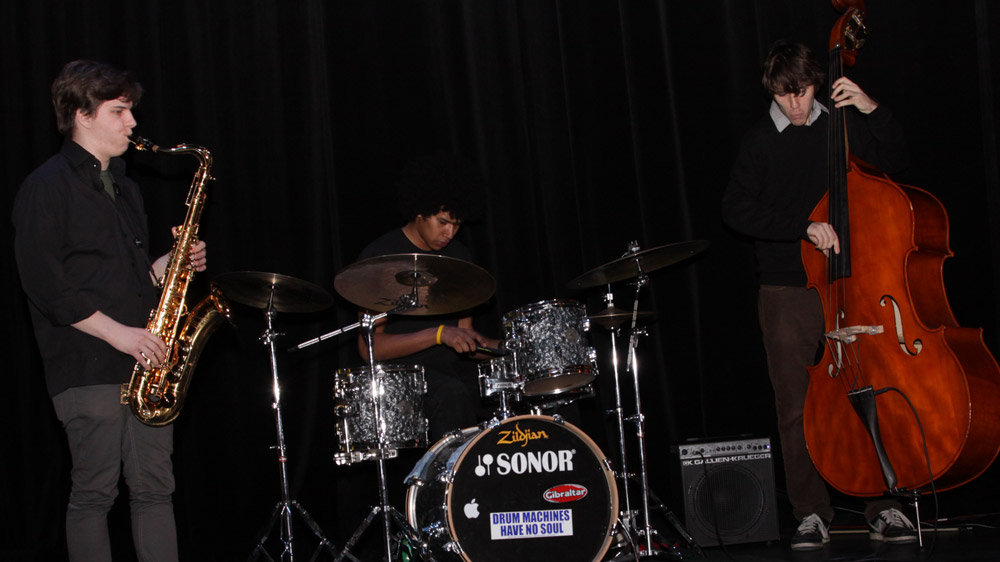 The Leland Whitty Trio warms up the crowd before the competition (left to right): Leland Whitty on tenor saxophone, Julian Clarke on drums, and Wesley Allen on bass.